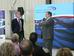 Sen. Mark Udall (left) and AOPA President Craig Fuller fielded questions from Denver-area pilots.