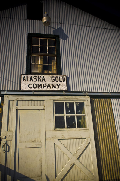 The Alaska Gold Company sign looks like it is on a building, but this building is part of a river dredge that worked the river near Fairbanks for gold.