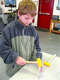 David Medina of the New Market Troop 4628 helps build a wing rib.
