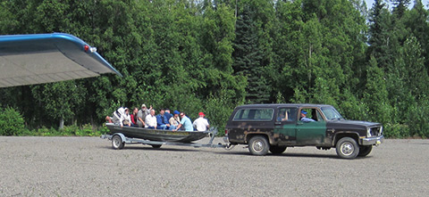 Members of Russian FATA enjoy a ride in a boat taxi at the Skwentna Roadhouse.