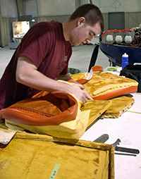 Removing the old seat upholstery.