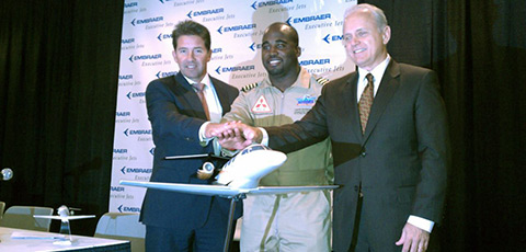 Miami Executive Aviation Founder Fabio Alexander, Barrington Irving, and Ernest Edwards, president of Embraer Executive Jets