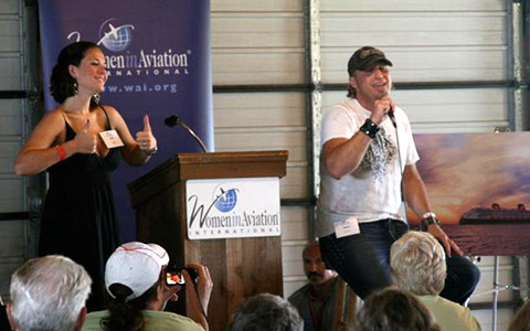 Lisa (left) performs interpretative sign language to Ansel's song.