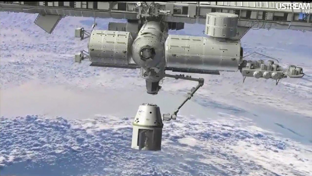 A NASA/SpaceX animation showing the Dragon spacecraft in the grip of the International Space Station's robotic arm. Photo courtesy of NASA.