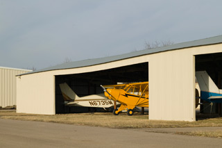 tube and fabric aircraft in a hangar