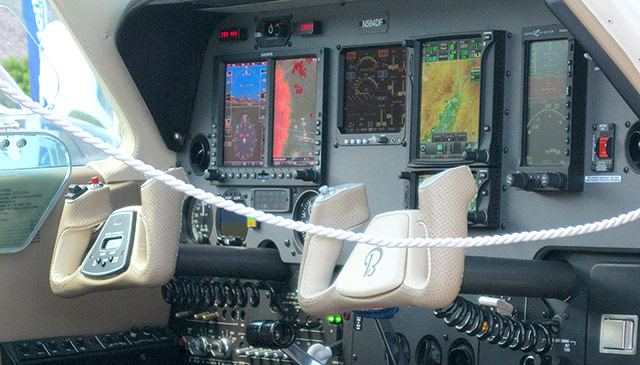 Aviation Design hand stitches leather yoke covers.