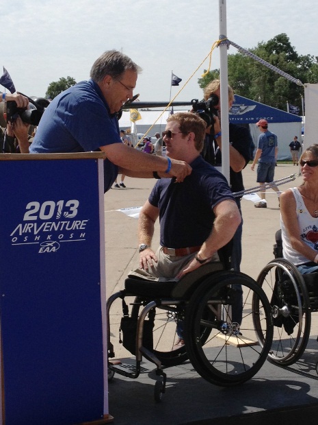 AOPA President Craig Fuller (left) pins wings on Andrew Kinard at a ceremony honoring Able Flight scholarship recipients.