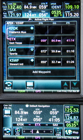 The Garmin panel components include the GTN 750 (top) and GTN 650 (above), which are touchscreen-controlled all-in-one units containing VHF nav and comm radios, transponder controls, and GPS navigators. They also show ADS-B traffic and weather information on dedicated screen views. Here the 750 shows the legs on a trip from AOPA’s home base to the paint shop, KD Aviation, which is based at Stewart International Airport in Newburgh, New York. The GTN 650 screen displays the default nav view.