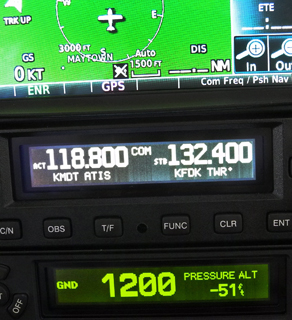 The GNC 255A at the center of this Garmin avionics stack includes a database that identifies frequencies for nearby airports, ATC, and navaids.