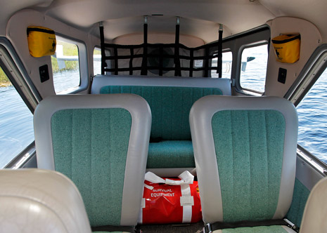 The passenger cabin is spacious, and a fishing rod holder in the rear bulkhead is one of many modifications.