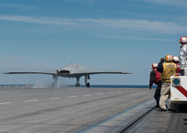 Unmanned combat air system catapults from carrier.