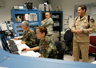 Silverstein recognized the uniform insignia worn by the man at right, a staffer of the Air and Marine Operations Center working with military personnel. U.S. Department of Homeland Security photo.