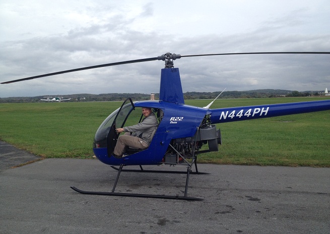 All smiles after the helicopter intro flight.