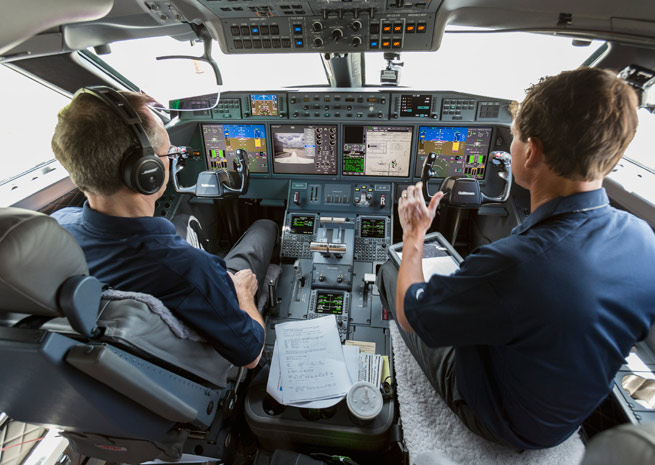 Gulfstream Pilots Bud Ball, left, and Eric Parker, right, perform pre‐flight checks before flying the G650 from Savannah to San Diego, where the G650 began its around-the-world record attempt.