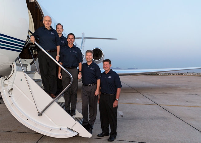 The Gulfstream flight crew for the G650's around-the-world record. From left: Tom Horne, Bud Ball, Eric Parker, Ross Oetjen, and John McGrath.