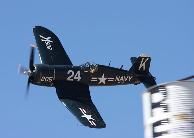 Doug Matthews competes in the F4U-4B Corsair dubbed Hudner in honor of Medal of Honor recipient Capt. Thomas J. Hudner, U.S. Navy (ret.) at the National Championship Air Races. Photo by Robert Fisher