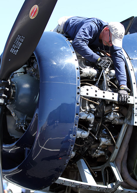 Working on a round motor at the National Championship Air Races. Photo by Robert Fisher