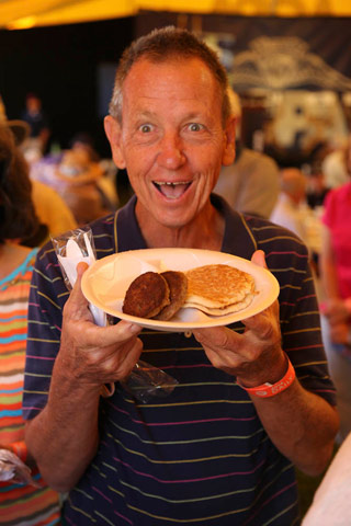 An excited attendee at AOPA's breakfast at Sun 'n Fun can't wait to chow down on pancakes.