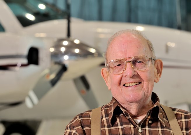 Ed Adams poses with Randall Tuttle's Baron at Landmark Aviation, at Smith Reynolds Airport in Winston-Salem, N.C.