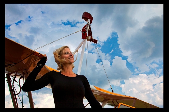 0416_wingwalker Jane Wicker, shown in 2011 with Stearman biplane Aurora. Wicker's friends want to restore the airplane in her memory.