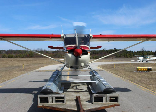 The trailer has an extension to add distance between the aircraft and pickup truck ahead. Photo by Robert Ericson, Orchard Beach Aviation.