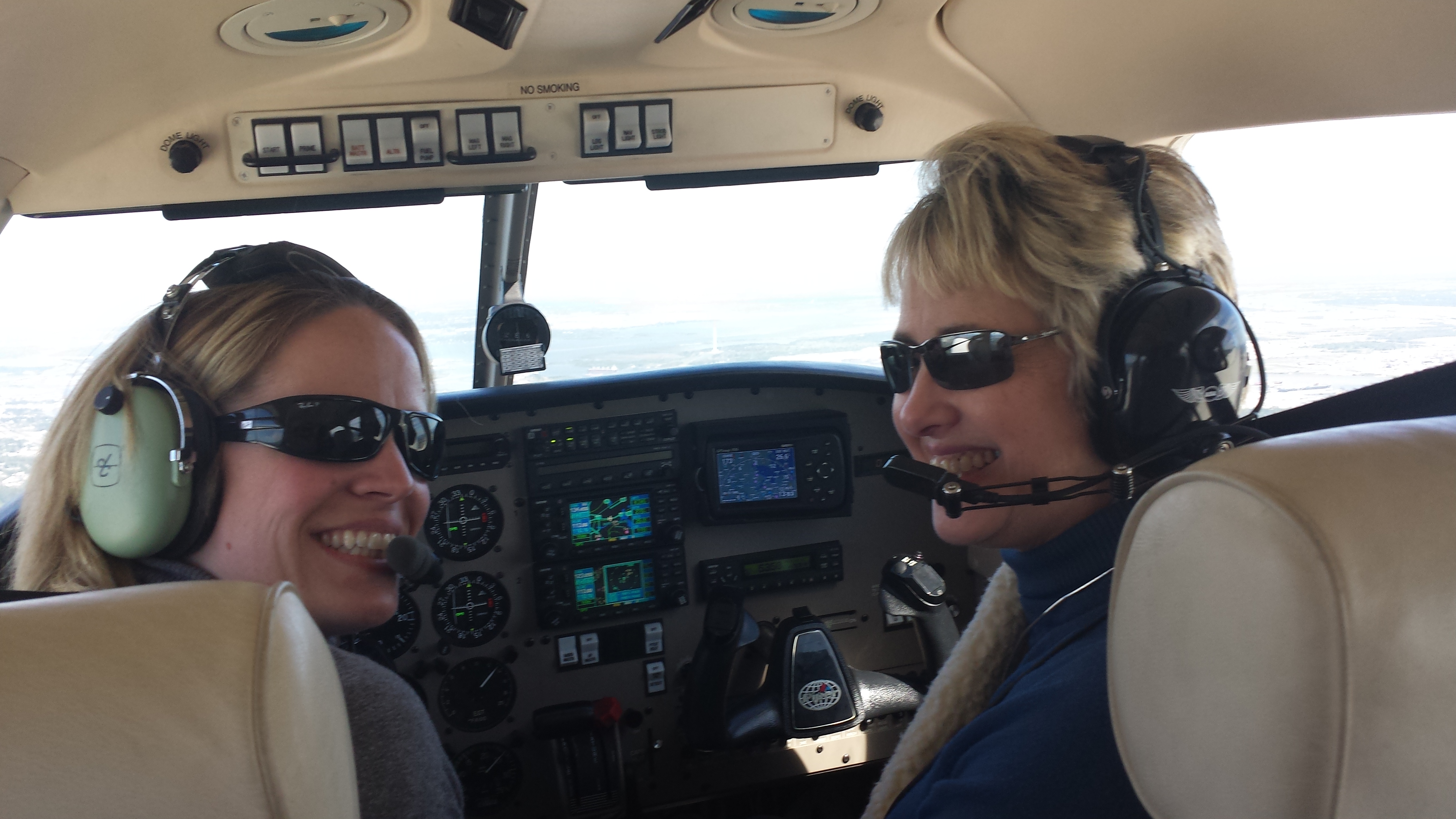 AOPA Central Southwest Regional Manager Yasmina Platt (left) takes Houston Mayor Annise Parker for a flight over the city.