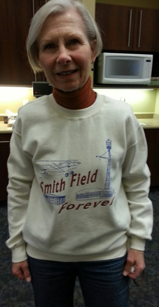 Airport supporter Norene Brown wears a Save Smith Field sweatshirt.