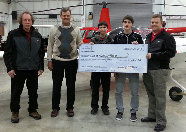 Smith Airfield Forever (SAFE) donates a scholarship for two teenagers to learn how to fly. Left to right: SAFE President David DeWald, SAFE Vice President Marcus Brewer, Andrew Griffith, Rigel Jaquish, and Sweet Aviation General Manager Joel Pierce.