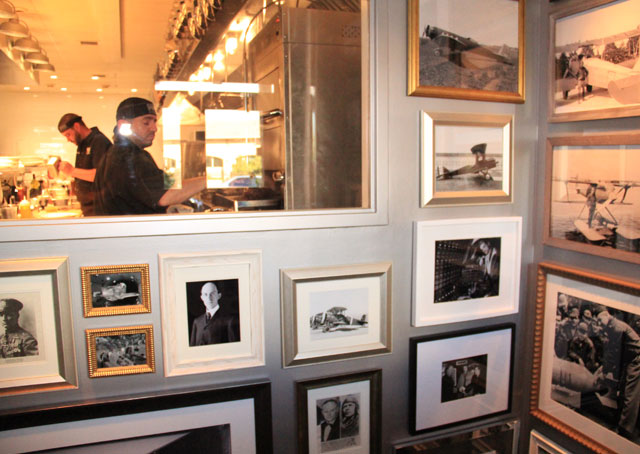 The kitchen of PM Prime, surrounded by original aviation photos.