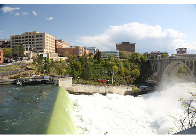 Visitors can see Spokane Falls crashing over basalt rock.