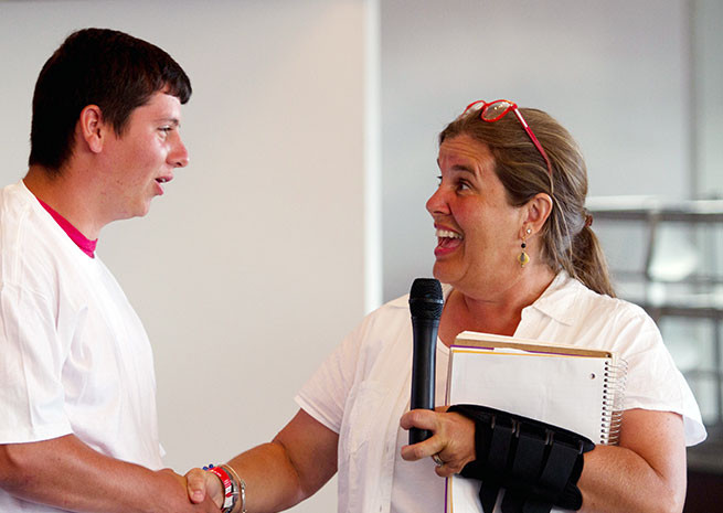 The late Katrina Bradshaw, executive director of Build A Plane until her death in 2013, congratulated one of the program participants during an event at EAA AirVenture in 2012. 