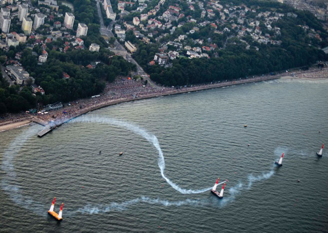 U.S. pilot Kirby Chambliss weaves through the pylons at the Red Bull Air Race in Gdynia, Poland. Joerg Mitter photo courtesy of Red Bull.
