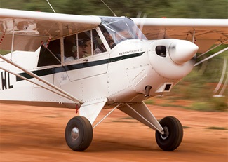 Richard Spencer, a retired U.S. Marine pilot, lands in Kilaguni with one of the newer Kenya Wildlife Service Pilots.