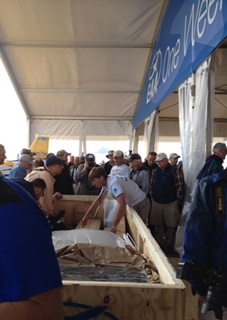 Volunteers open the first crates of parts for the One Week Wonder project at EAA AirVenture.