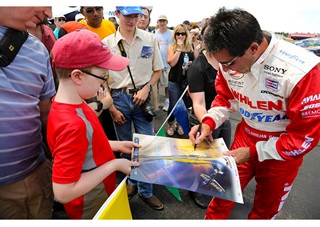 Airshow performer Michael Goulian signed autographs for potential future pilots.