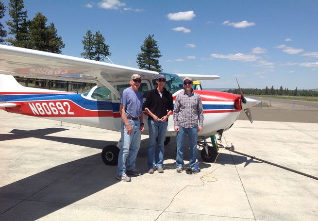 Club members Richard Frasch, left, and his son David, right, with CFI and member Charla Whiting after completing their very first flight lesson on June 6, 2014.