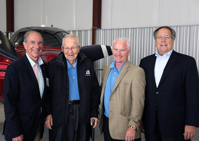 Former AOPA President Phil Boyer, charter member Earle Blomeyer, AOPA President Mark Baker, and former AOPA President Craig Fuller celebrate AOPA's seventy-fifth anniversary at Wings Field.