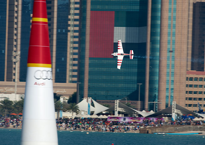Paul Bonhomme of Great Britain performs and wins the race ahead of Hannes Arch of Austria (2nd) and Pete McLeod of Canada (3rd) on the first stage of the Red Bull Air Race World Championship in Abu Dhabi, United Arab Emirates on March 1. Photo by Naim Chidiac/Red Bull Content Pool.