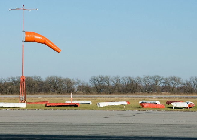 Look at the windsock to see if weather reports match its instant indications.