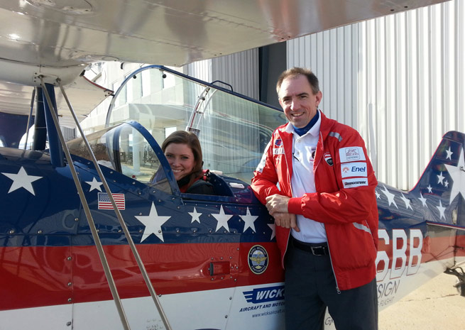 Samantha Norton of IndyJet prepares to go on a thrill ride with airshow performer Billy Werth at Indianapolis Regional Airport.