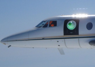 The laser turret is mounted in what used to be the doorway of Philadelphia-area businessman Matthew McDevitt’s Falcon 10. Air Force Research Laboratory photo. 