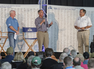 Former AOPA presidents Phil Boyer (center) and Craig Fuller (right) joined AOPA President Mark Baker (left) on stage during the Pilot Town Hall.