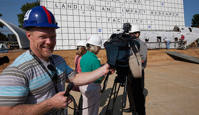 Can’t blame a guy for enjoying a nice, sunny day and a five-ton helicopter drop. NASA photo. 