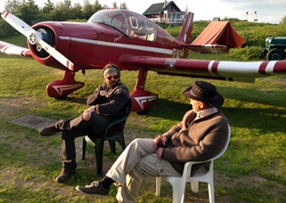 Haukur Snorrason, left, and his brother Jón Karl Snorrason relax in July, with their Jodel D.140C TF ULF in the background.