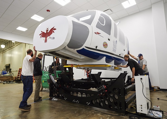 Employees install Case Western's new simulator