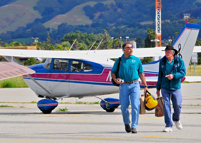 Vikas Kapur and Ralph Zerweck of the Santa Clara County Airman’s association walking toward the DART Operations tent with food donations. Photo courtesy of SCAPA/Paul Marshall.