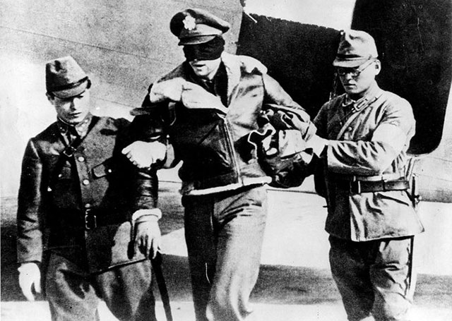 Robert L. Hite, then a lieutenant and later a lieutenant colonel, in the hands of Japanese captors following the 1942 raid on Tokyo. U.S. Air Force photo.