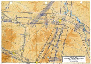 A 1943 sectional chart shows the airway network as it existed then. The beacon labeled “49” is the location of the MacDonald Pass beacon now listed on the National Register of Historic Places. The location is labeled “McDONALD PASS” with both a beacon light code and a radio station code charted. Map image courtesy of Mike Rogan, Montana DOT Aeronautics Division. Click on the image for a larger version. 