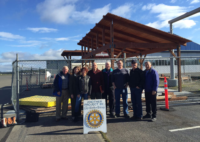 Community groups and the county cooperated to get the educational and inviting structure built. Left to right: Lee Smith, director, community Service, Rotary Club of Gig Harbor (morning club); Deb Wallace, Airport and Ferry administrator, Pierce County Airport and Ferry Division; Brett Marlo DeSantis, Rotary Club of Gig Harbor member and president, Brett Marlo Designs Inc.; Randy Barcalow, construction foreman/site manager, Rotary Club of Gig Harbor; Warren Hendrickson, Tacoma Narrows Airport AOPA Airport Support Network volunteer; Jay Simons, maintenance and operations supervisor, Pierce County Airport and Ferry Division; Roger Gruener, founder, Friends of Tacoma Narrows Airport (FOTNA); and Jim Castino, AOPA member, Tacoma Narrows pilot, Rotary Club of Gig Harbor member, project architect, and principal, Castino Architecture. Photo courtesy Warren Hendrickson.