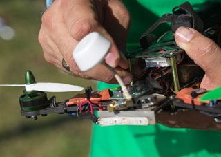 An FPV drone like this one can be assembled from a kit for a few hundred dollars, and some are sold complete, though pilots must learn to repair them sooner or later. Photo by Jim Moore.